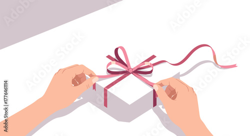Hands tying ribbon on gift box in minimalist style