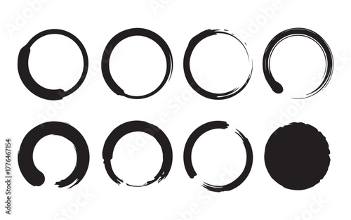  Collection of eight hand painted black ink brush stroke circles and ovals on white background