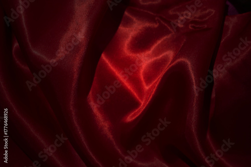 top view close-up of red satin fabric, smooth and luxurious, beautiful, classy, ​​wavy texture