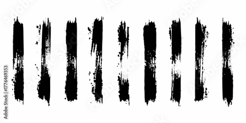 Collection of ten vertical black grunge brush strokes with rough edges and textured details on white background