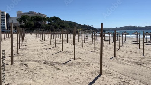 End of season / beginning of season, beach umbrellas are being set up / taken down on the beach, Santa Ponsa, Calvia, Mallorca