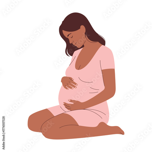 A pregnant woman sits with her hands cradling her baby bump.