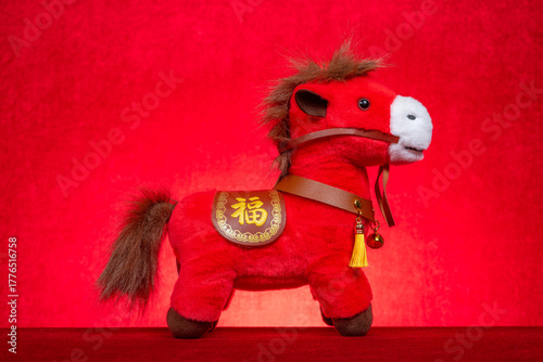 Chinese New Year of Horse mascot on red the Chinese word means fortune