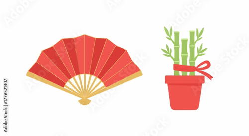 A collection of traditional Asian good luck symbols, featuring a red folding hand fan and a potted lucky bamboo plant for prosperity
