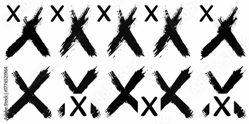 Collection of black brush stroke xs and small xs on a white background