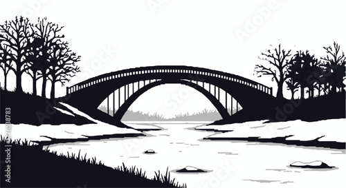 Serene arched bridge crossing a calm river surrounded by silhouetted bare trees on a crisp winter day.
