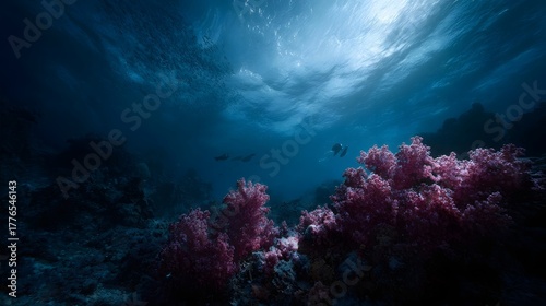 Fototapeta Naklejka Na Ścianę i Meble -  Vibrant underwater coral reef ecosystem with diver and school of fish under sunlit surface