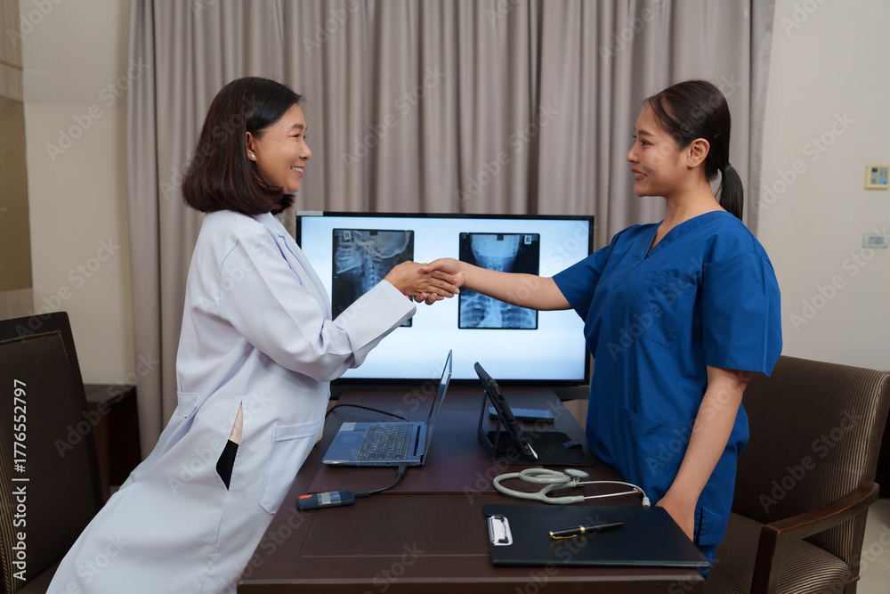 Fototapeta premium A female doctor is examining the shoulder bone of an elderly patient. 