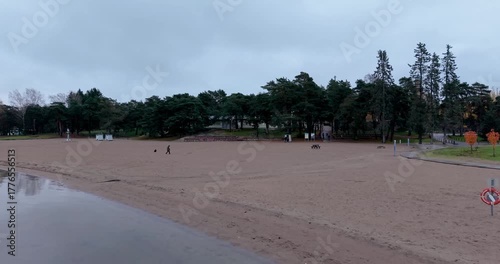 Aerial rise from Hietaranta Beach revealing Helsinki city center