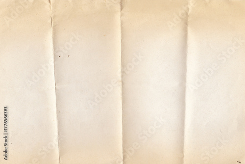 Antique Paper Texture. Folded Old Paper Background. Old vintage paper folded in four. Brown crumpled and folded parchment vintage paper sheet with space for text