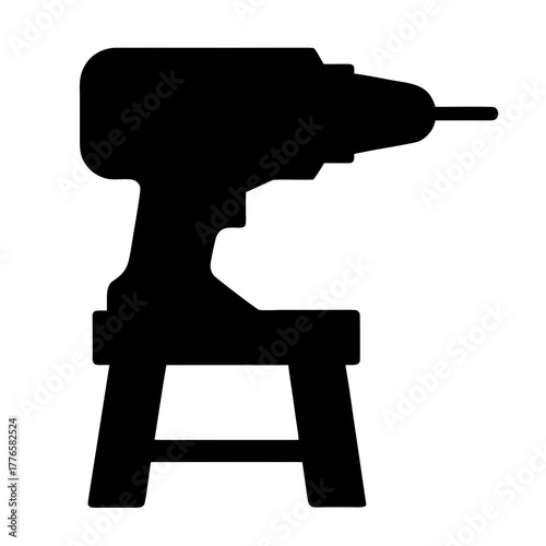 Black silhouette of a power drill on a stool