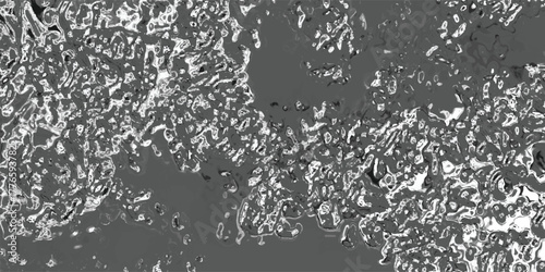 Abstract grayscale pattern with irregular, blob-like shapes and high contrast between light and dark areas, resembling a cellular or biological structure