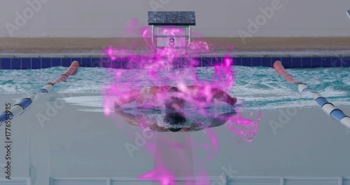 Swimming butterfly stroke cutting through water near lane ropes, block 8, with purple digital glow