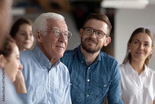 Group Portrait of Smiling Multigenerational Team in Office Setting.