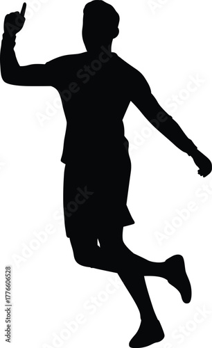 Silhouette of a male athlete in motion jumping and pointing upwards with a determined expression