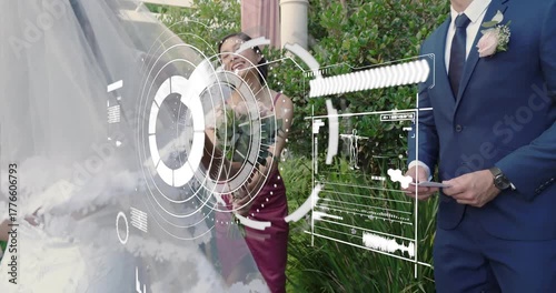 Groom retrieving vow card and passing to bride, couple exchanging wedding vows beneath pergola