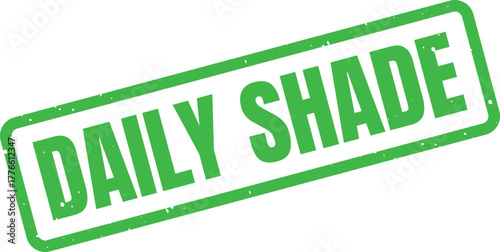 A vibrant green rectangular rubber stamp with a textured appearance spells out the words DAILY SHADE