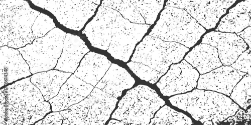 Dry, cracked earth texture on the desert ground illustrates the severe impact of drought and arid climate on natural soil