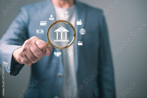 Businessman holding magnifying glass with AI banking icons concept, representing financial technology innovation, data analysis, fintech security, and artificial intelligence in digital finance.
