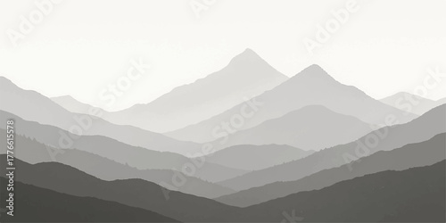 Misty blue mountain peaks and forest landscape in the morning sun and haze