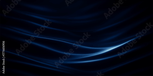 Smooth black satin fabric with flowing waves of light and a subtle pattern forms a rich texture backdrop