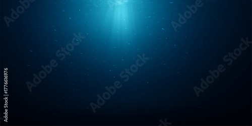 Abstract blue background with glowing rays of sunlight filtering through deep ocean water