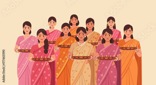 Group of women in saris holding trays of lit diyas.