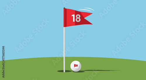 A golf ball rests on a green next to the 18th hole flag on a clear day.