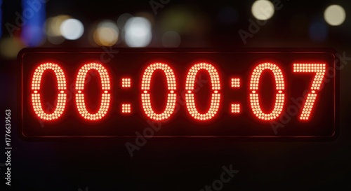 Illuminated digital timer display showing zero minutes and seven seconds