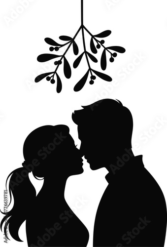 Couple kissing under mistletoe silhouette love