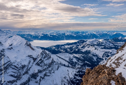 Swiss Alps Winter Landscape of Glacier 3000 with Sea of Clouds and Mountain in Switzerland.