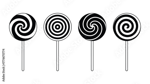 Four swirling black and white spiral lollipops on white background