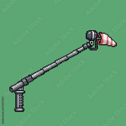 A pixel art illustration of a professional boom microphone with a windsock on a solid green background.