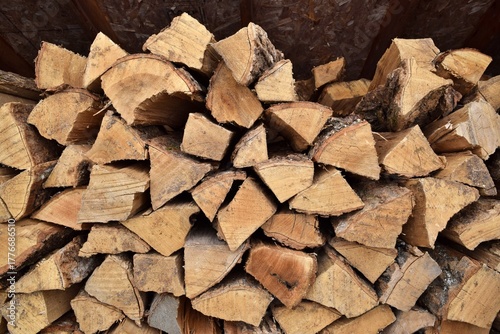 Photos A woodpile in a shelter, ready for wood burning during winter