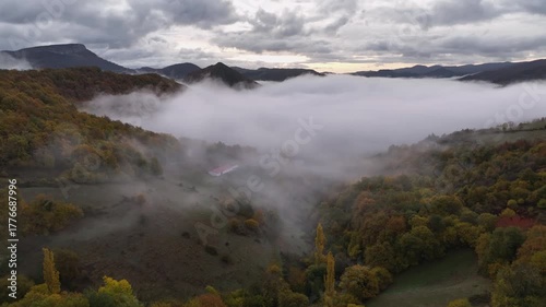 An autumn morning with fog in the valley. Aezkoa Valley, Navarrese Pyrenees