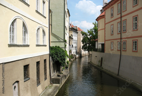 Photography The Čertovka river between houses in Prague