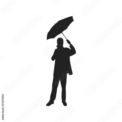silhouette of person holding umbrella