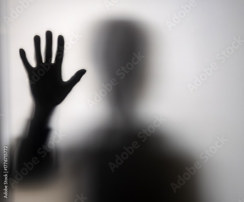 Hands behind a glass