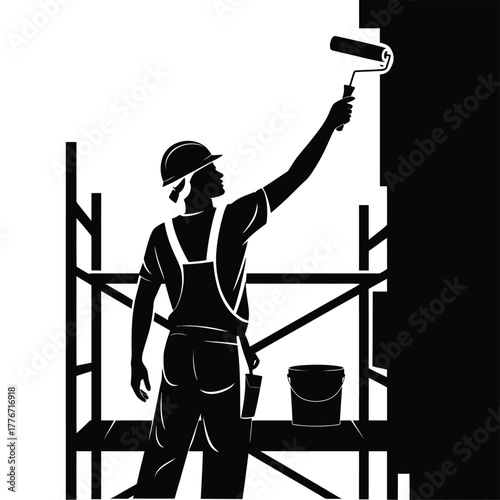 Silhouette of a painter working on scaffolding with a roller