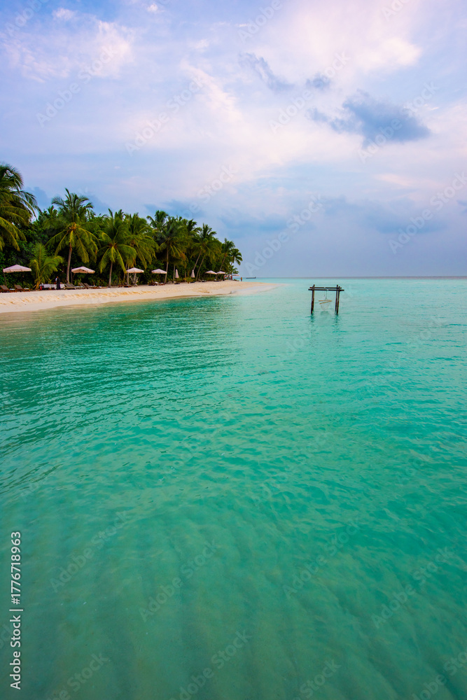 Fototapeta premium Tranquil closeup calm sea water waves with palm trees. Beautiful Panorama, Tropical island beach landscape exotic shore coast. Summer vacation, holiday amazing nature. Relax paradise, Maldives.