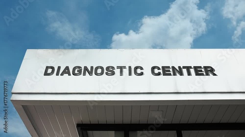 Diagnostic Center word sign displayed on building facade with clear blue sky, highlighting a healthcare facility offering medical testing, diagnostics, and health services