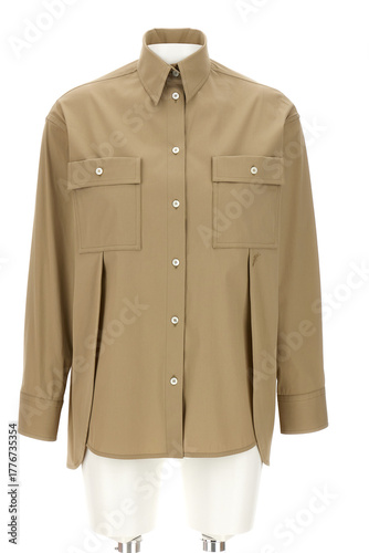 A stylish tan or beige colored long sleeve button up shirt with two chest pockets and a collared neckline presented on a mannequin