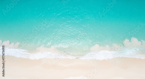 Top view of serene beach with turquoise water and golden sand