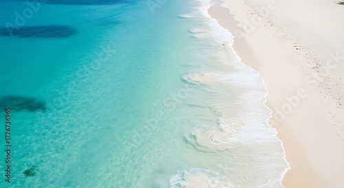 Aerial view of tropical beach with turquoise ocean and white sand