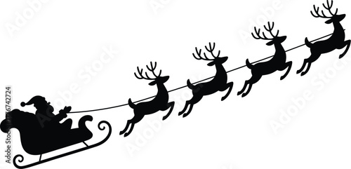 Silhouette of santa claus in his sleigh pulled by reindeer flying across the night sky on christmas eve