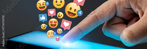 Finger touching a smartphone screen with social media emojis and notifications representing online engagement and digital communication in the modern world of mobile technology and social networking