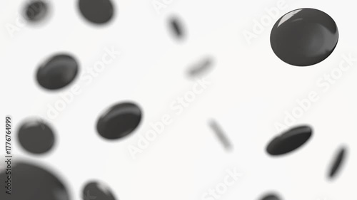 Black round badge falling in slow motion, depth of field
