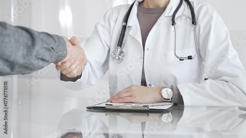 Doctor and patient hands shaking, symbolizing trust, agreement, healthcare partnership, successful consultation, and medical service. Medicine and health care