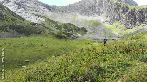 Magnificent mountain landscape, drone video. a tourist enjoys the view of the mountain peaks, unity with nature. breathtaking panorama of distant mountains