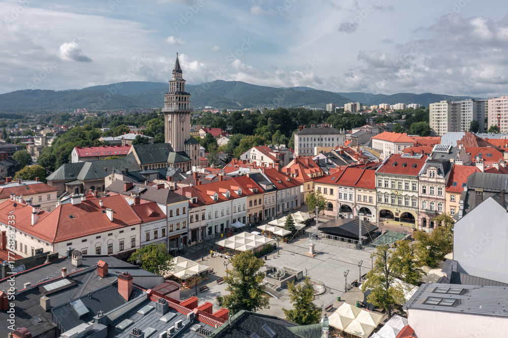 Fototapeta premium Aerial view of historic old town square with colorful buildings and clock tower in Bielsko-Biała, Silesia, Poland